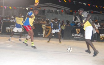 Action during Saturday night’s Guinness Greatest of the Streets Exhibition Competition at the new Albouystown Basketball Court.  (Orlando Charles photo)