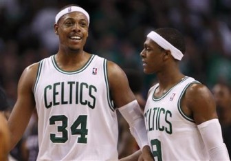 Boston Celtics’ Paul Pierce (34) celebrates with Rajon Rondo during Game 4 of their Eastern Conference Finals NBA basketball playoffs against the Miami Heat in Boston, Massachusetts June 3, 2012. Reuters/Jessica Rinaldi