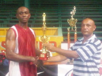 Royston Siland (left) receives his MVP trophy at the end of the tournament (Treiston Joseph photo)