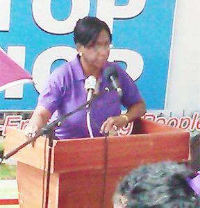 Central Housing and Planning Authority Chief Executive Officer Myrna Pitt addressing the prospective land owners at the first One Stop Shop exercise, held at the National Stadium, at Providence yesterday. 
