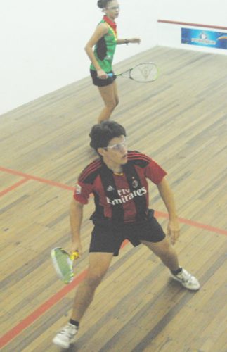 Action during the Farfan and Mendes Junior Team Tournament at the Georgetown Club squash facility on Wednesday. (Orlando Charles photo)