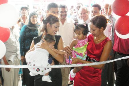 Homeline Furnishing’s proprietors’ daughters, Fareena and Fareeza Hamid and their children, Haley and Fahmeemah cut the ribbon to officially open the shopping mall 