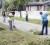 Minister of Natural Resources and the Environment Robert Persaud (right) and PS at the ministry Joslyn McKenzie hard at work raking-up weeds when the ministry kicked off its ‘Pick it up Guyana’ campaign in East La Penitence on Saturday. 