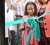 Ann Grant (right), the wife of Eddy Grant, is all smiles as her granddaughter, Mya Kellman, cuts the ribbon for the Eddy Grant Resource Centre, which was commissioned yesterday at Plaisance. (Photo by Anjuli Persaud)