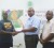 TCL Manager, Mark Bender, second right, hands over the cheque to RHTY&SC’s Ronson Lawson, left in the presence of the TCL’s Eric Whaul.