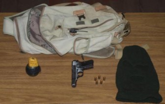 The grenade and gun that the police found (Police photo)