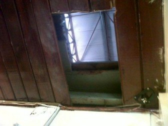 The hole cut in the roof of the stall