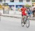 Robin Persaud crosses the finish line ahead of reigning junior road race champion and club mate Raynauth Jeffrey to capture this year’s ninth annual National Milling Company (NAMILCO) Caricom ‘Wheat-up’ Cycle Road Race yesterday. (Orlando Charles photo)