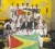 The Guyana Karate College team proudly drapes its members with Guyana flags. (Photo courtesy of the Guyana Karate College)