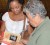 Author of British Politics towards the Amerindians in British Guiana 1803-1873, Mary N Menezes (right) autographs a copy of her book.