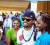 Machel Montano poses with a fan shortly after his arrival at the CJIA.