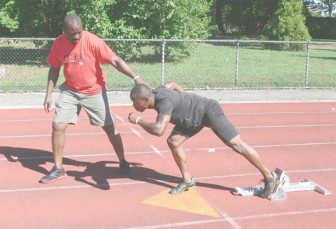 Jeremy Bascom and his coach preparing for today’s 400m preliminary rounds at the London Olympic Games.