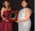 Recognition: In recognition of her services to Guyanese while she held the   portfolio of Minister of Human Services and Social Security, now   Education Minister Priya Manickchand was honoured by the New York Guyana Medical and Humanitarian Mission (NYGM) at a ceremony at the Hotel Tower on Saturday.
Member of NYGM, Holly Persaud (left)  presents plaque to Minister of Education, Priya Manickchand (GINA photo)
