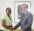 Lyndanie Brandon being congratulated by the Canadian High Commissioner, David Devine

