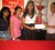 Marketing Executive of Digicel (Guyana) Jayana Butts(extreme right) yesterday handed over a sponsorship cheque and a trophy on behalf of the telephone company to coordinator of the Guyana Cup, Melissa Chattergoon, and from left Amrita Dharamjit and Cindy Mohamed look on.

