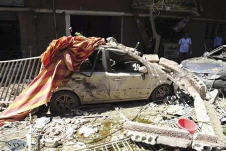 A view shows the wreckage after a car bomb exploded in the Jaramana district of southeast Damascus September 3, 2012, in this handout photograph released by Syria’s national news agency SANA. (Reuters/SANA)