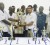 Shane Cummings, right, a representative of Sterling Products Limited, hands over the winner’s trophy to competition coordinator, Dennis Pompey, in the presence of a number of the Demerara players.