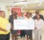 Scotiabank’s Jennifer Cipriani (right) and representatives from Childlink display an emblematic cheque for US$8,500 while other recipients look on. 