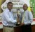 Ministry of Tourism’s Indranauth Haralsingh (left) and Lusignan Golf Club’s president Jerome Khan display the President’s Cup lien Trophy.