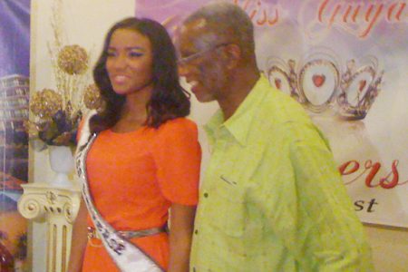 Miss Universe 2011, Leila Lopes poses with local franchise holder Odinga
Lumumba at the Princess Hotel