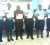 Six of the seven awardees pose with their certificates