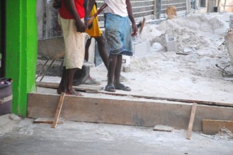 These workmen were last week on duty ona large construction site in the city with footwear that is far removed from regulation  safety shoes.