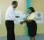 Minister Frank Anthony presenting Indra Persaud with her certificate