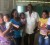 Minister of Local Government and Regional Development, Ganga Persaud (second, right) poses with some mothers and children during the outreach