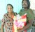 Hampers for seniors: In honour of the month of the elderly, the Union/Naarstigheid Neighbourhood Democratic Council (NDC) on Friday distributed 25 hampers to senior citizens.
The hampers which included food items, detergents and toiletries have been distributed to persons from within the NDC for the past 15 years. This is the first year they have decided to highlight it though, according to the acting overseer, Renai Mc Almont.
In photo, Mc Almont (right) presents a hamper to 78-year-old Beatrice Rachpaul, known of ‘Aunty Bee’ of Bush Lot. The woman said she felt special that the NDC identified her for a hamper and she expressed gratitude to them.
Mc Almont said it was a pleasure distributing the hampers to the elderly whose ages range from 75 to 96. Two persons in their 90s who received hampers were Ramnauth Boodram, 93, of Bush Lot and James Edwards, 96, of No 22 Bel Air.