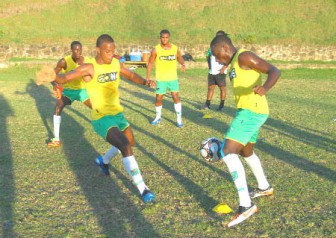 Members of the Golden Jaguars team going through the practice session yesterday at the Gros Islet ground. (Orlando Charles photo)