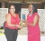 Rotary Club of Stabroek President Luana Falconer presents Cynthia Massay with a plaque in honour of her contributions to meet the needs of persons with disabilities. 