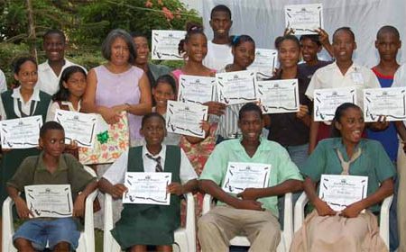 Gem Madhoo-Nascimento poses with some of the graduates on her Youth Theatre Workshop (Stabroek News file photo)
