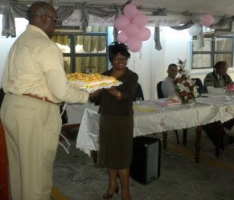 Karen Livan receiving a cake at her farewell reception (Ministry of Natural Resources photo)