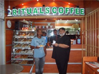 Naeem Nasir (right) at his Rituals coffee shop