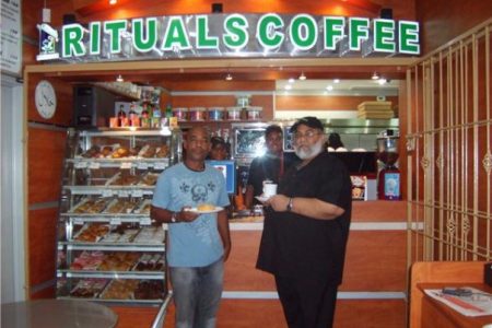 Naeem Nasir (right) at his Rituals coffee shop