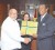 New Bahamas High Commissioner to the Caribbean Community (Caricom) Picewell Forbes presents a gift to President Donald Ramotar in the presence of Minister of Foreign Affairs Carolyn Rordigues-Birkett. (GINA photo)