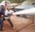 A Guyana Fire Service officer teaches Region 8 REO Ronald Harsawack to control a pump gushing with water when putting out a fire, as other volunteers look on.  