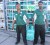 Two employees of the Vlissengen Road Rubis Service Station hold up a cylinder of the rebranded gas.
