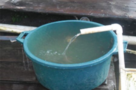 This pipe is the only source of water for residents of Hill Street, Albouystown 