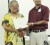 Facilitator Lorna McPherson presents Dr Navindranauth Rambaran with his certificate of participation.
