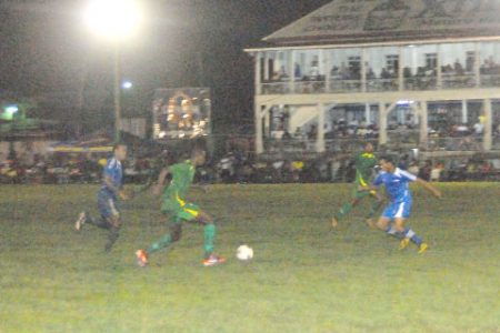 On the attack!  A rampant Daniel Wilson (with ball) in action against B.V United, Tuesday night at the GFC ground. (Orlando Charles photo)