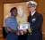 Sub Lt Wayne Richmond receives the honour student plaque from Commander John C. Cowan, the NAVSCIATTS Commanding Officer. (Photo courtesy of the Guyana Defence Force)
