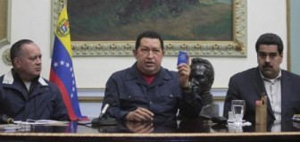 Venezuelan President Hugo Chavez sat next to Vice President Nicolas Maduro, right, and National Assembly President Diosdado Cabello during a national broadcast. (Reuters photo)