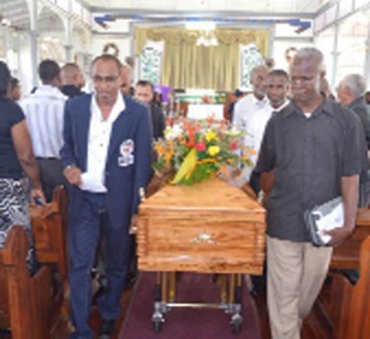 The coffin with the late Sydney Cummings inside is being taken from the Bedford Methodist Church to his final resting place.