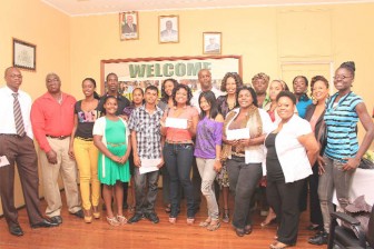 Director of the Drama Festival Godfrey Henry (second, left) and the winners of the Drama Festival 2012 at the Cash Award Presentation yesterday in the Ministry of Culture, Youth and Sport Boardroom. (Photo by Arian Browne) 