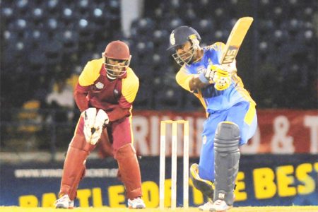 Barbados skipper Dwayne Smith belts a delivery from Justin Athanaze, not in picture for another boundary. (Photo courtesy WICB media)