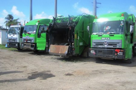 Four of the eight City Council trucks that are down at the City’s Solid Waste Management Department and Municipal Mechanic Workshop. (Government Information Agency photograph)
