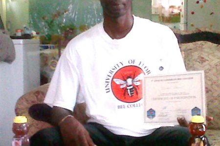 Linden Stewart with his awards from the recent Honey Fair in Grenada