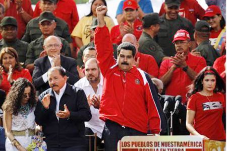 Venezuelan vice president Nicolas Maduro (C) attends a rally in support of President Hugo Chavez in Caracas yesterday. (REUTERS/ Carlos Garcia Rawlins)
