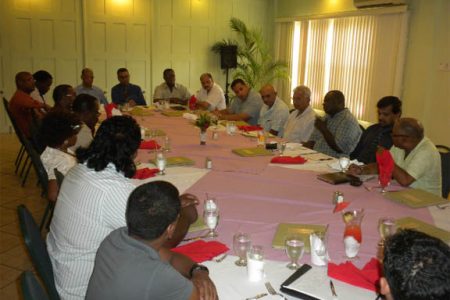 Ministers Clement Rohee, Robert persaud and Bheri Ramsaran (seated at the head of table) with members of the GGDMA and others at a stakeholders’ luncheon on Wednesday.